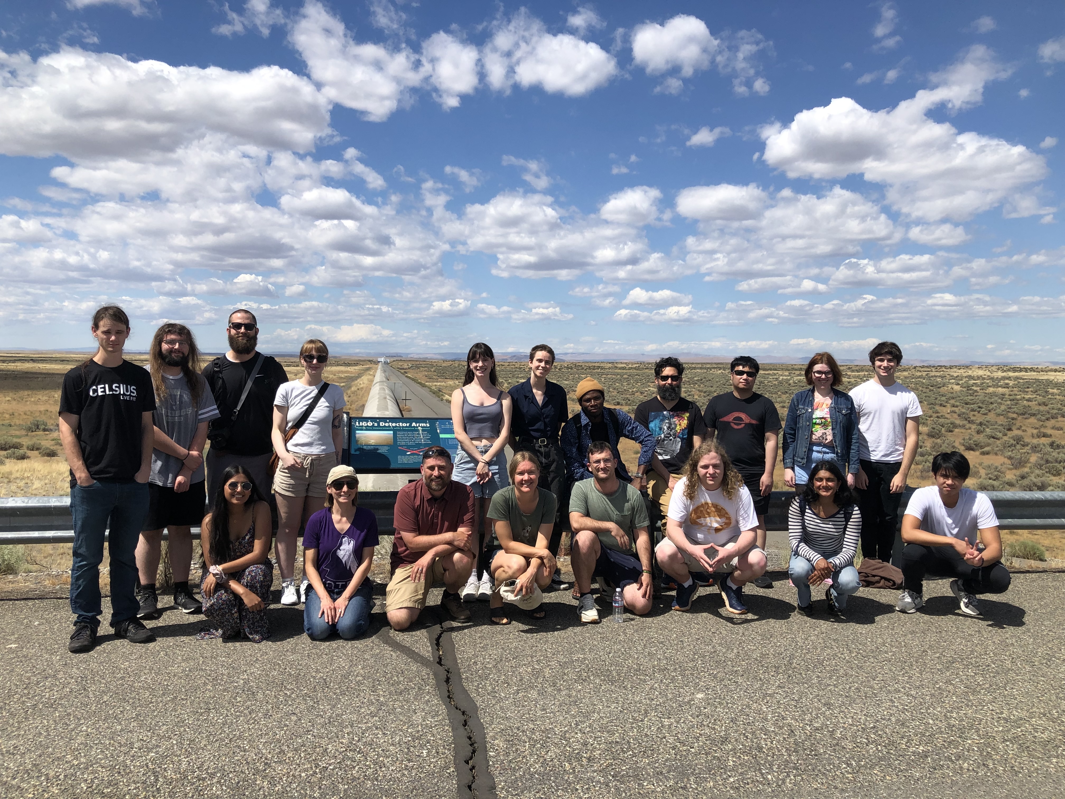 Professors and students
	  in the RAISE Team assembled for a group photo in front of
	  one of the arms of the LIGO array